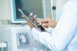 Medical_technology_or_medical_network._doctor_using_digital_tablet_with_screen_interface,medical_technology_network_concept,Medicine_doctor_and_stethoscope_in_hand_touching_icon_medical_network_connection_with_modern_screen_interface.