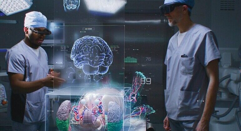 Diverse_male_surgeons_in_AR_headsets_work_in_operating_room_using_holographic_display._3D_graphics_of_virtual_human_skeleton,_organs_and_vital_signs._AI_technology_in_medicine._Futuristic_healthcare.