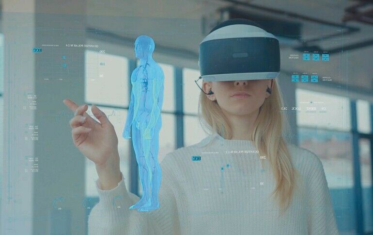 Augmented_Reality._Close-up_of_a_Female_Doctor_Looking:_Medical_Charts,_3D_Hologram_(DNA_hologram,_Pulmonary_System,_Muscular_System,_COVID-19)_Wearing_VR_Glasses_and_Headsets._Future_Medicine._VR_Glasses.
