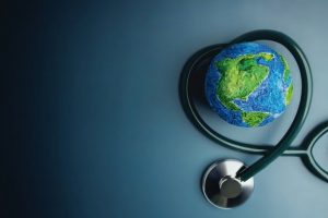 World_Health_Day._Global_Health_Awareness_Concept._Handmade_Globe_inside_Stethoscope_as_Heart_Shape._Green_Environment_to_Love_and_Care