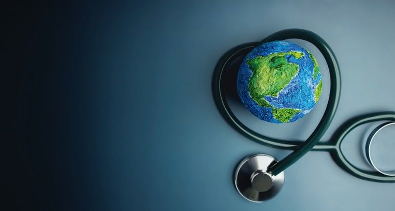 World_Health_Day._Global_Health_Awareness_Concept._Handmade_Globe_inside_Stethoscope_as_Heart_Shape._Green_Environment_to_Love_and_Care